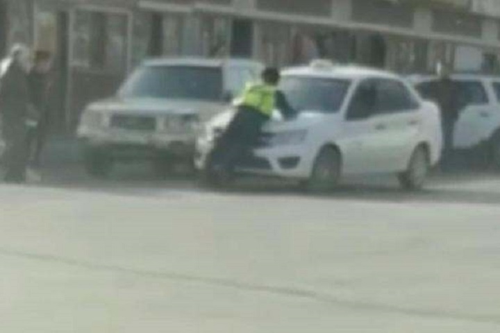 Оказал сопротивление: в Кызылорде полицейского протащили на капоте